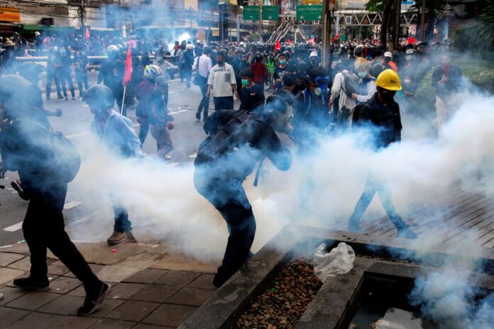 Demonstrators clash with police during anti-government protest in Bangkok