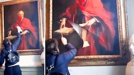 Aktivisten skär och  förstör historisk tavla